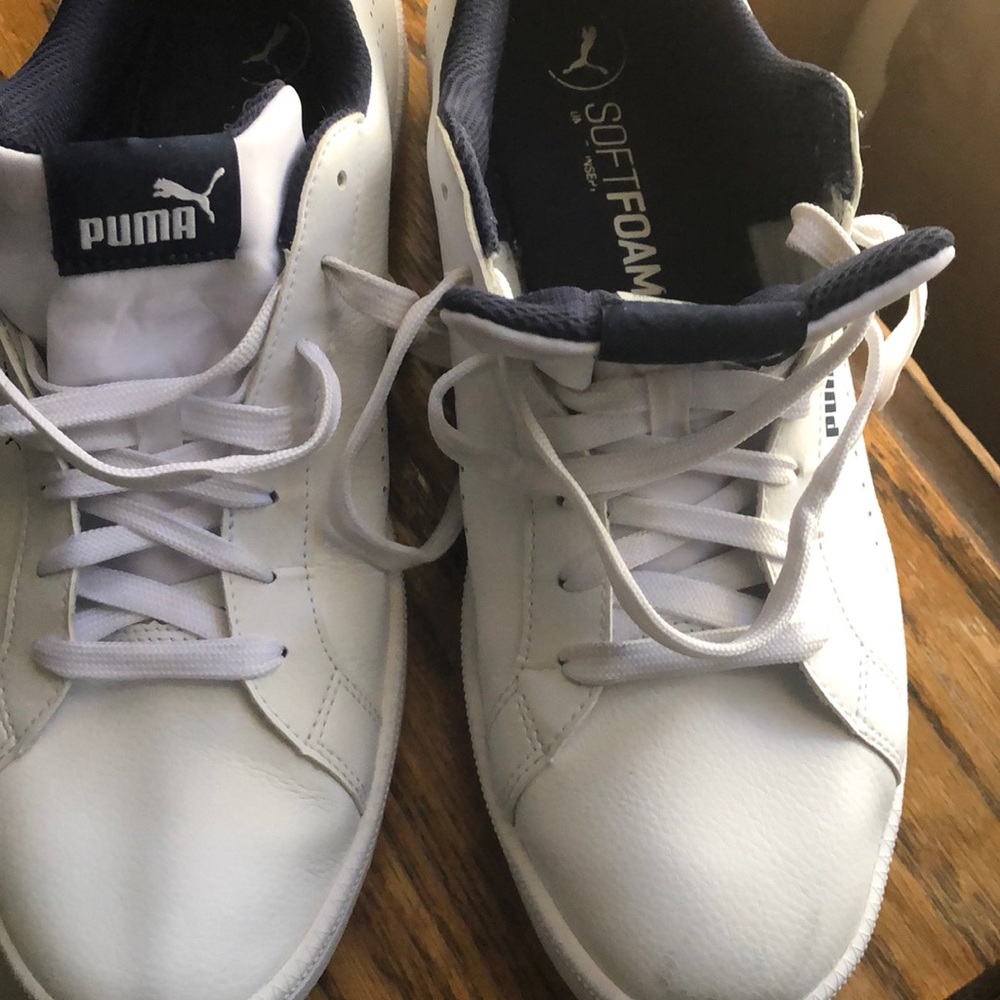 Men’s white and navy blue athletic shoes
